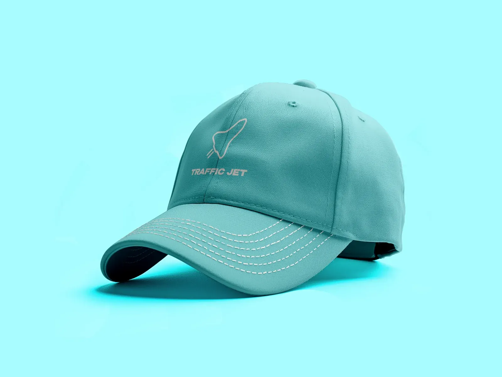 A teal cap with the Traffic Jet wordmark